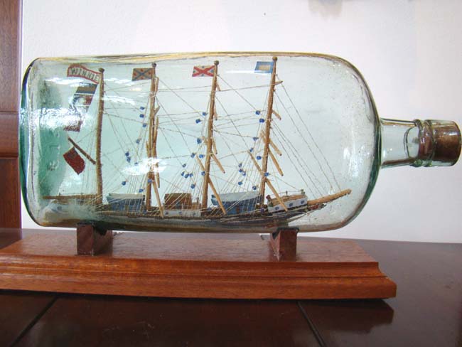 A rare and large antique four-masted ship-in-a bottle circa 1880-1900